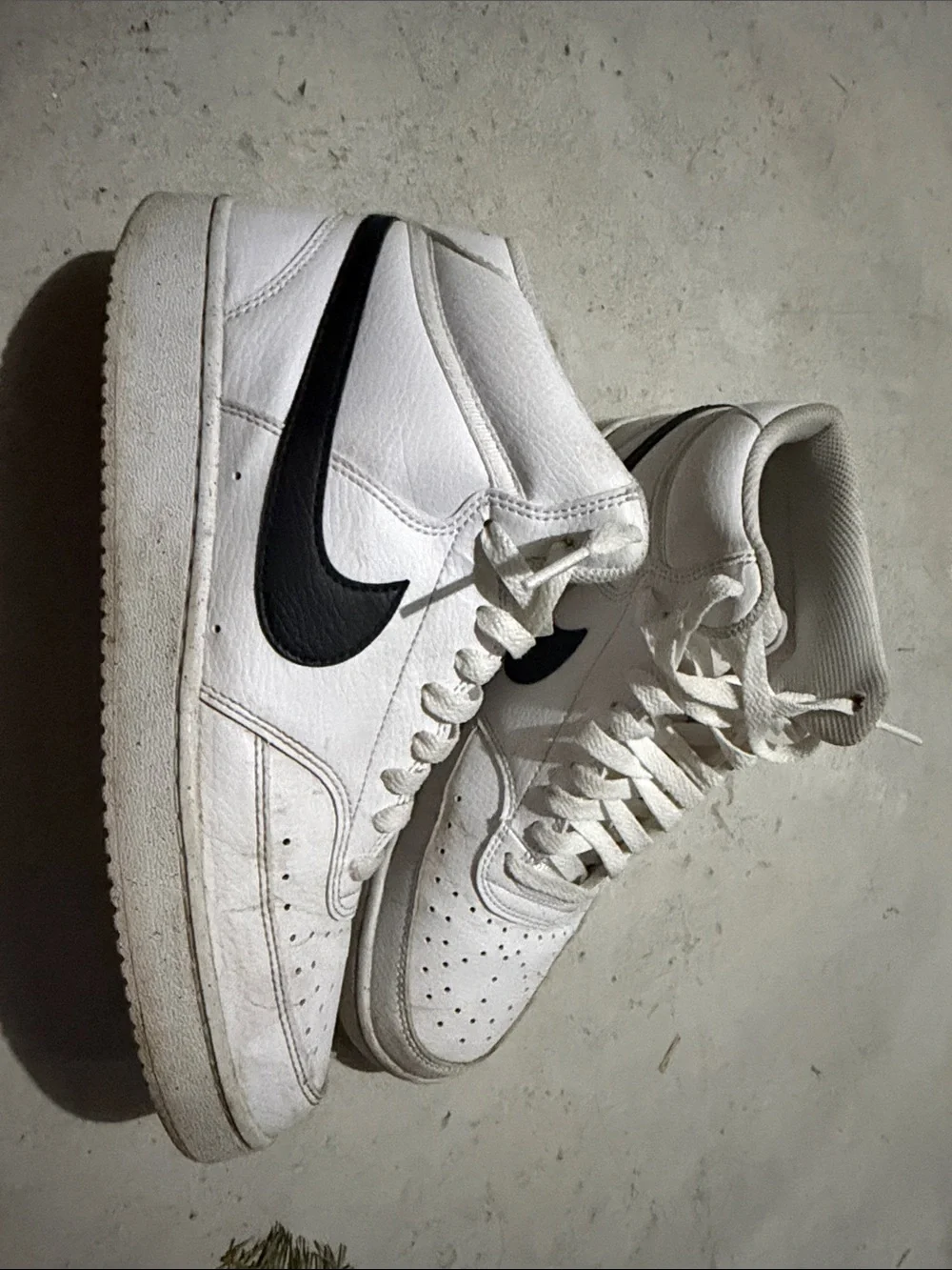 Nike White High-Top Sneakers with Black Swoosh
